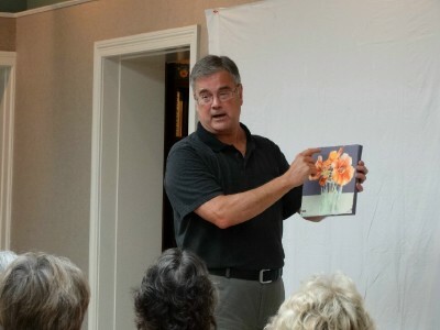 Todd appears in front of an audience, presenting one of his latest works